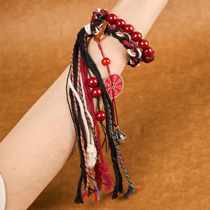 Pulsera de borlas de cuerda roja de doble capa con cinabrio y piedras de Buddha Stones tibetanas que gastan dinero