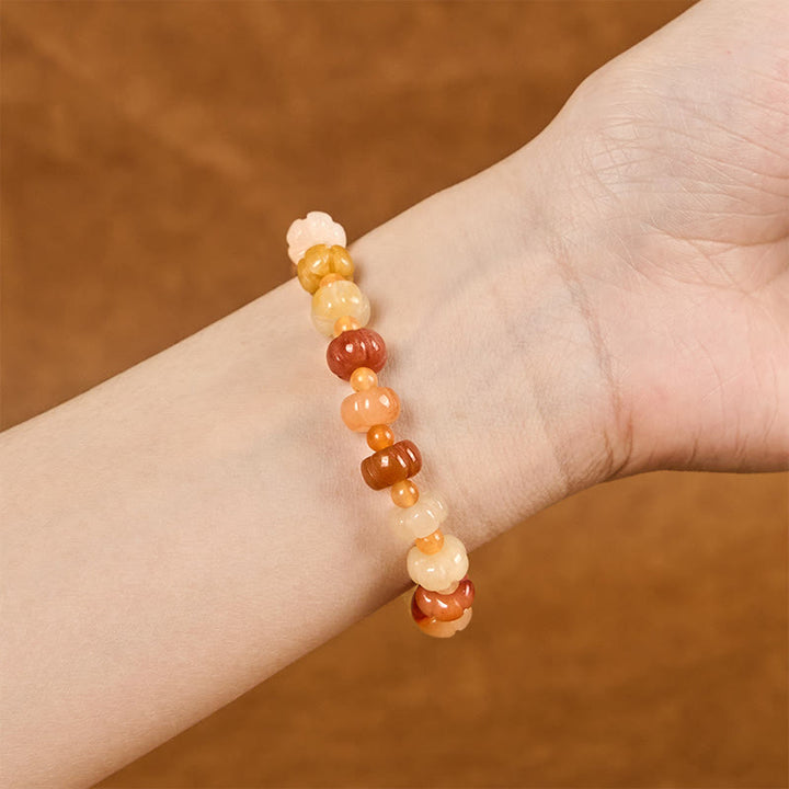 Pulsera de cuentas de calabaza de jade y seda dorada con Buddha Stones para la riqueza y la suerte