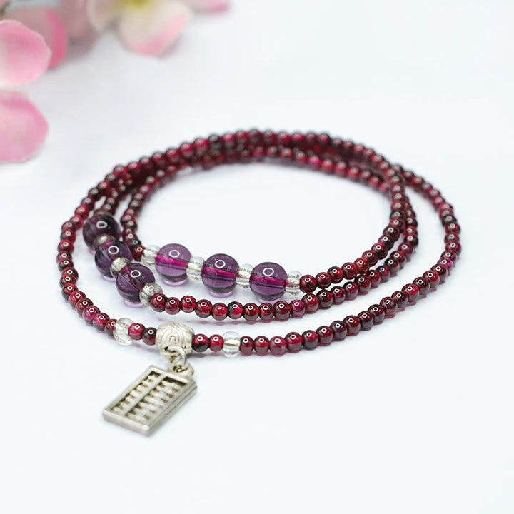Pulsera de triple vuelta con protección PiXiu, elefante, ábaco y granate natural con Buddha Stones y bolsa de la suerte