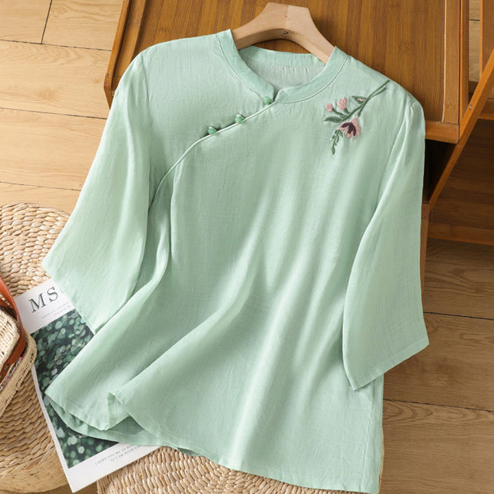 Camisa informal de lino y algodón con diseño de Buddha Stones para mujer, con flores y hojas bordadas, botones de rana, cuello redondo y media manga.