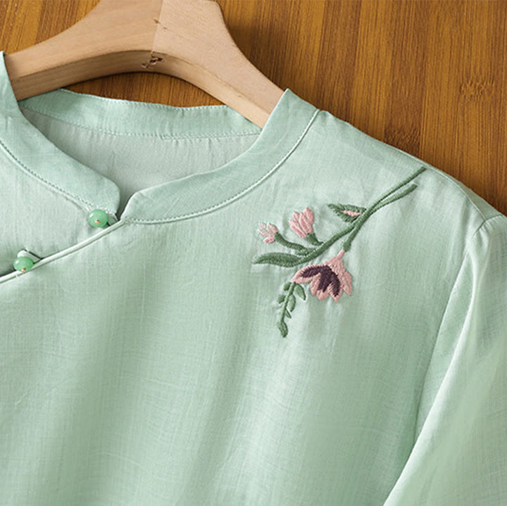 Camisa informal de lino y algodón con diseño de Buddha Stones para mujer, con flores y hojas bordadas, botones de rana, cuello redondo y media manga.