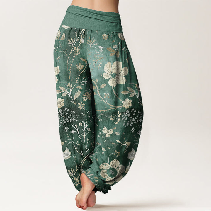 Pantalones harén para mujer con cintura elástica y diseño de flores blancas y vides sinuosas. - image 1