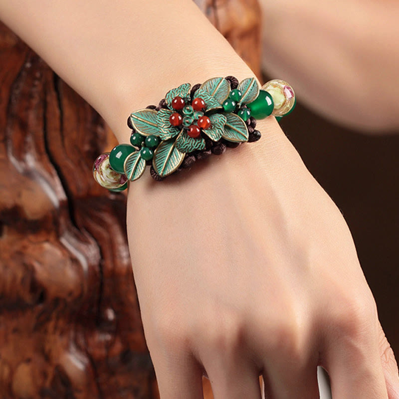Pulsera de soporte con nudo trenzado y cuentas de flores de vidrio de ágata verde de Buddha Stones