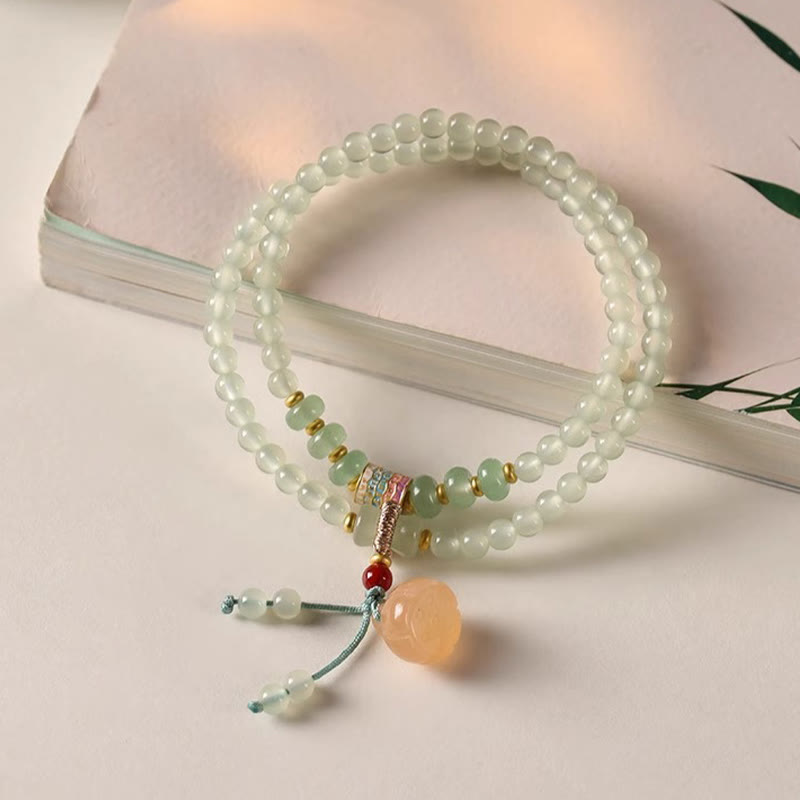 Pulsera de positividad con múltiples círculos de Buddha Stones, aventurina natural, vainas de loto y bambú de la suerte.