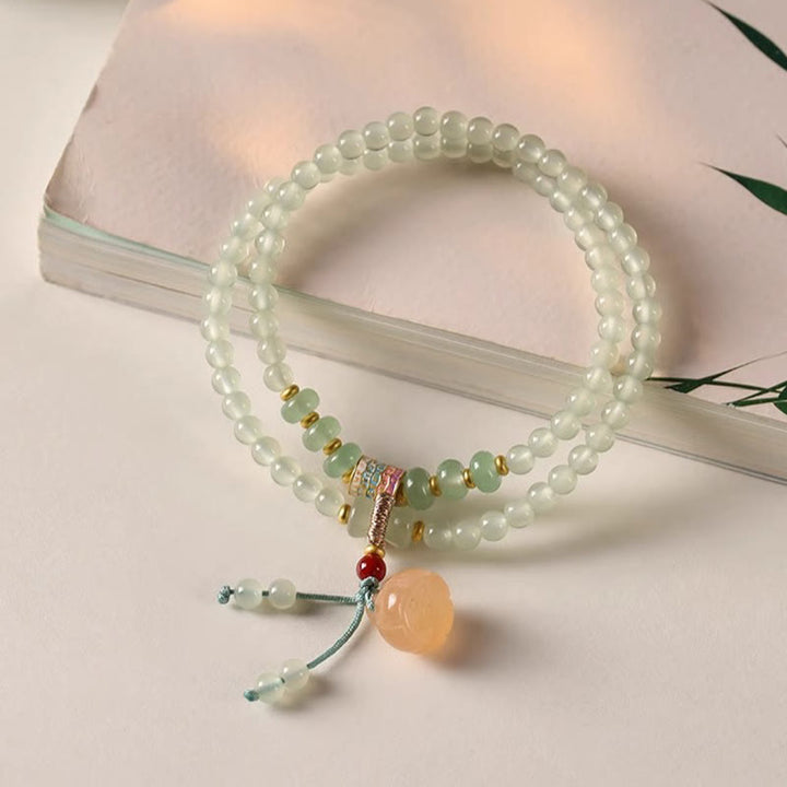 Pulsera de positividad con múltiples círculos de Buddha Stones, aventurina natural, vainas de loto y bambú de la suerte.