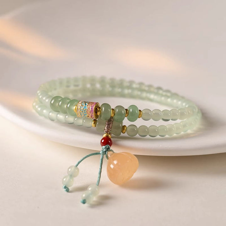 Pulsera de positividad con múltiples círculos de Buddha Stones, aventurina natural, vainas de loto y bambú de la suerte.