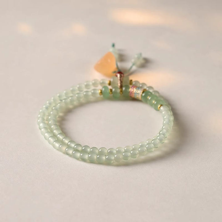 Pulsera de positividad con múltiples círculos de Buddha Stones, aventurina natural, vainas de loto y bambú de la suerte.