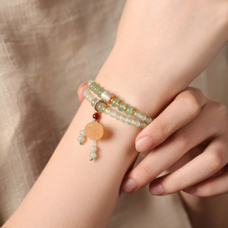 Pulsera de positividad con múltiples círculos de Buddha Stones, aventurina natural, vainas de loto y bambú de la suerte.