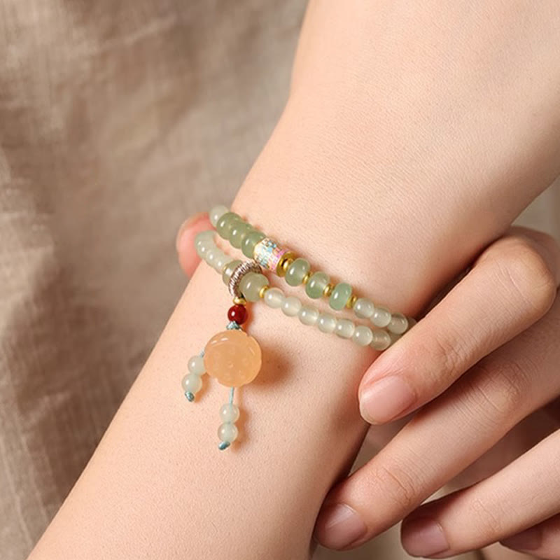 Pulsera de positividad con múltiples círculos de Buddha Stones, aventurina natural, vainas de loto y bambú de la suerte.