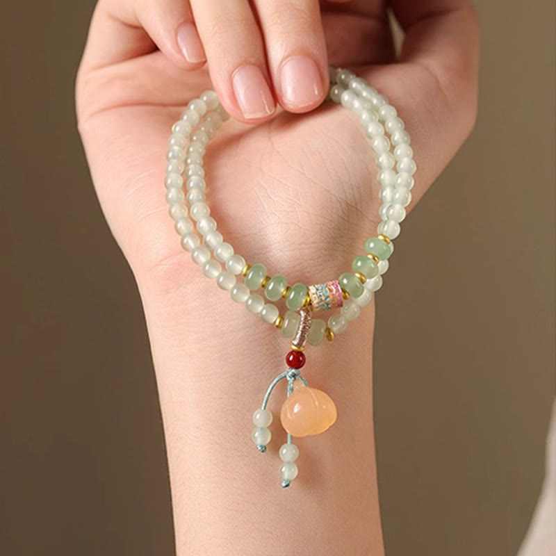 Pulsera de positividad con múltiples círculos de Buddha Stones, aventurina natural, vainas de loto y bambú de la suerte.
