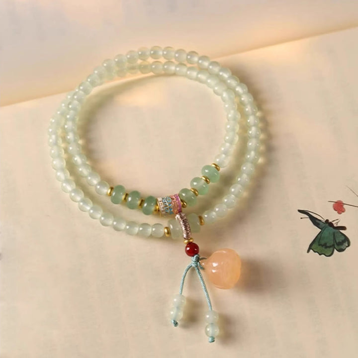 Pulsera de positividad con múltiples círculos de Buddha Stones, aventurina natural, vainas de loto y bambú de la suerte.