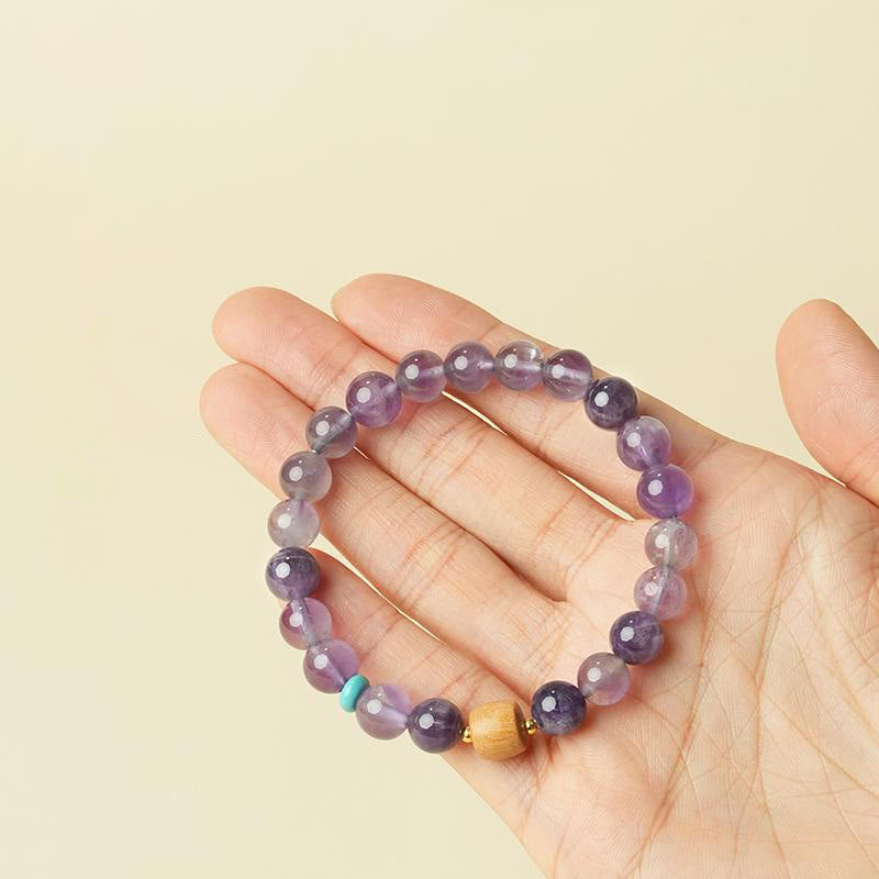 Pulsera de la paz con cuentas de madera de la suerte y amatista natural de Buddha Stones