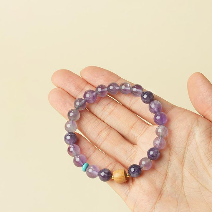 Pulsera de la paz con cuentas de madera de la suerte y amatista natural de Buddha Stones