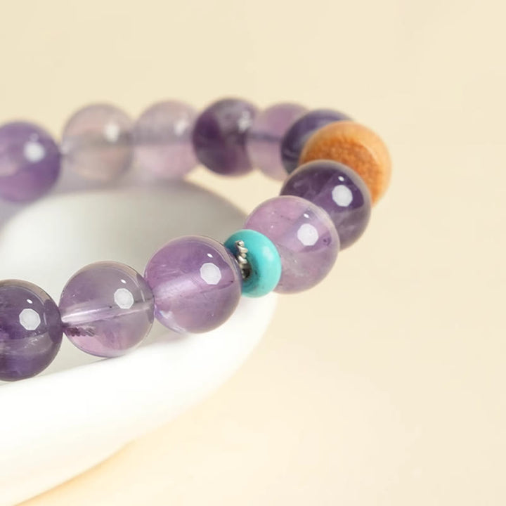 Pulsera de la paz con cuentas de madera de la suerte y amatista natural de Buddha Stones