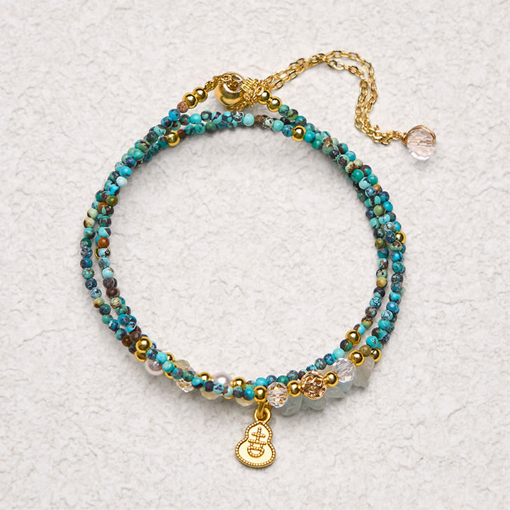Pulsera de triple vuelta con cuentas de turquesa y Buddha Stones