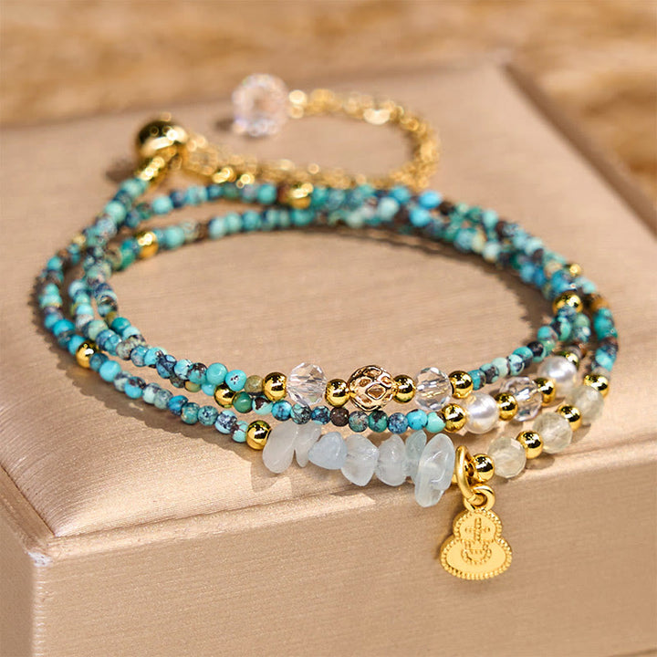 Pulsera de triple vuelta con cuentas de turquesa y Buddha Stones
