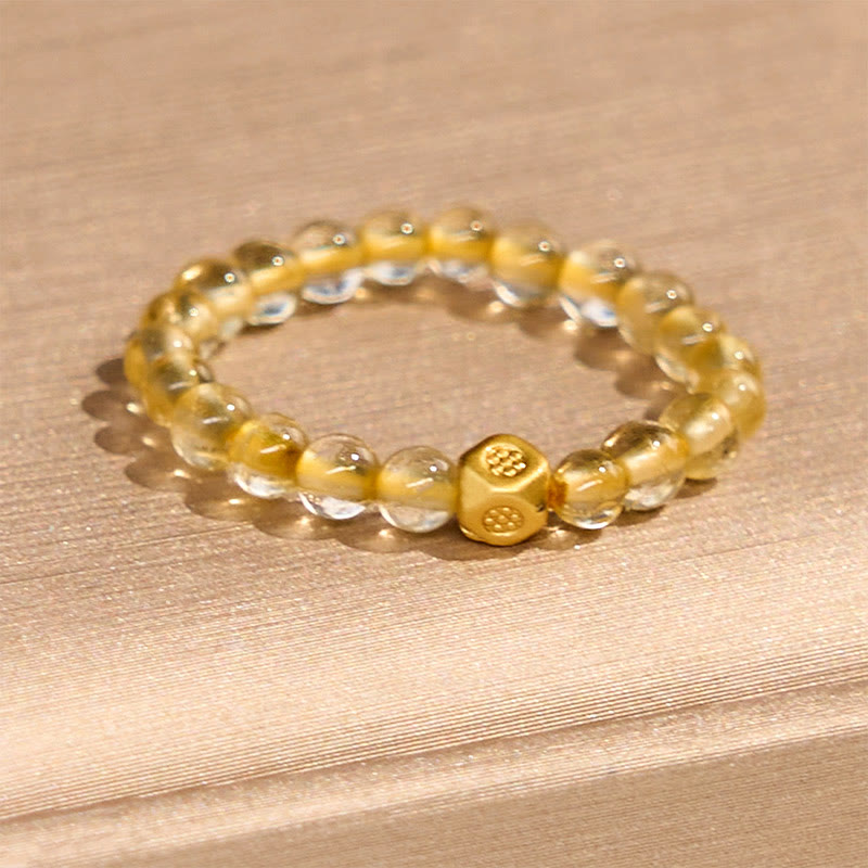 Anillo elástico de riqueza con cuentas de cuarzo rutilado dorado de 3 mm de Buddha Stones