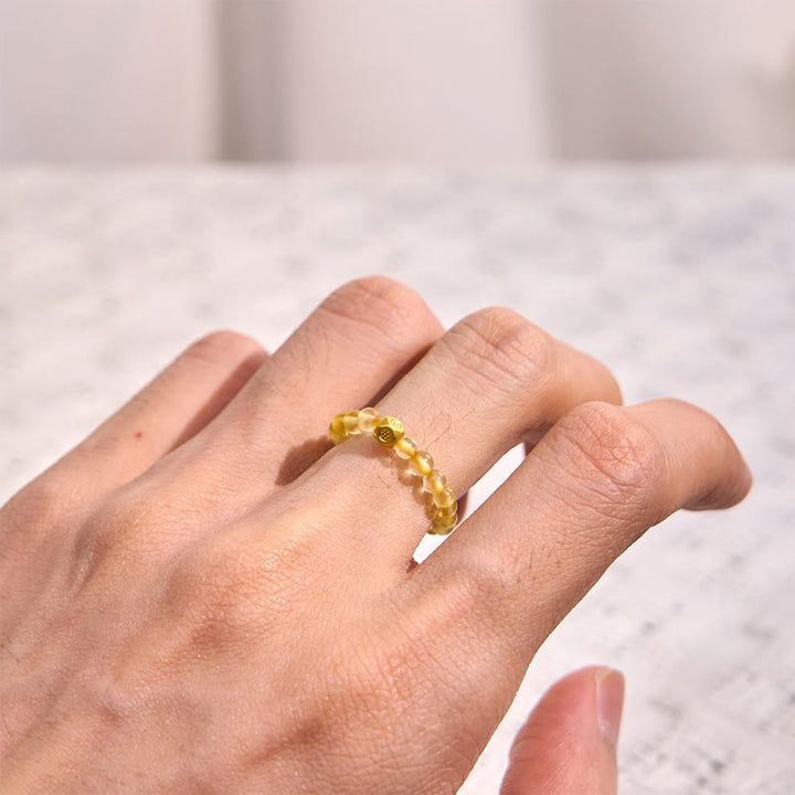 Anillo elástico de riqueza con cuentas de cuarzo rutilado dorado de 3 mm de Buddha Stones