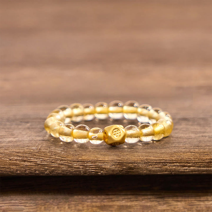 Anillo elástico de riqueza con cuentas de cuarzo rutilado dorado de 3 mm de Buddha Stones