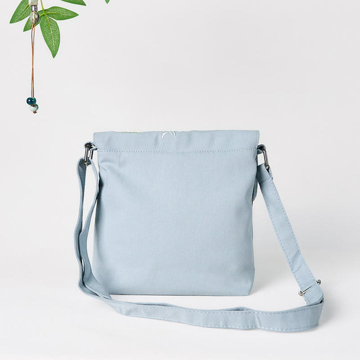 Bolso bandolera de lino y algodón con epifilo azul claro bordado con Buddha Stones