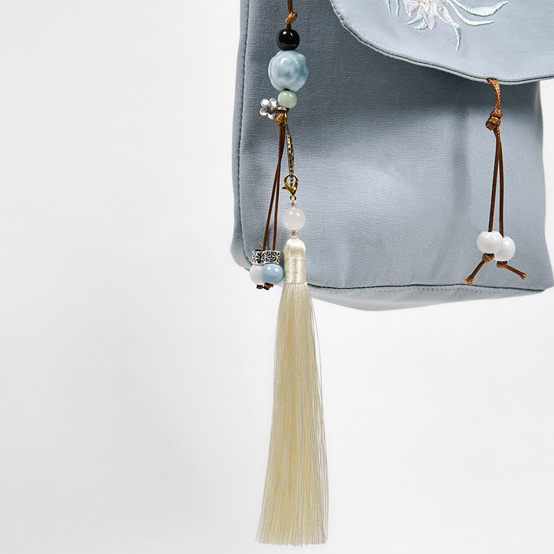 Bolso bandolera de lino y algodón con epifilo azul claro bordado con Buddha Stones