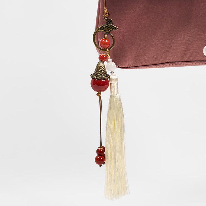 Bolso bandolera de lino y algodón con bordado de Buddha Stones , color marrón liso y ciruela.