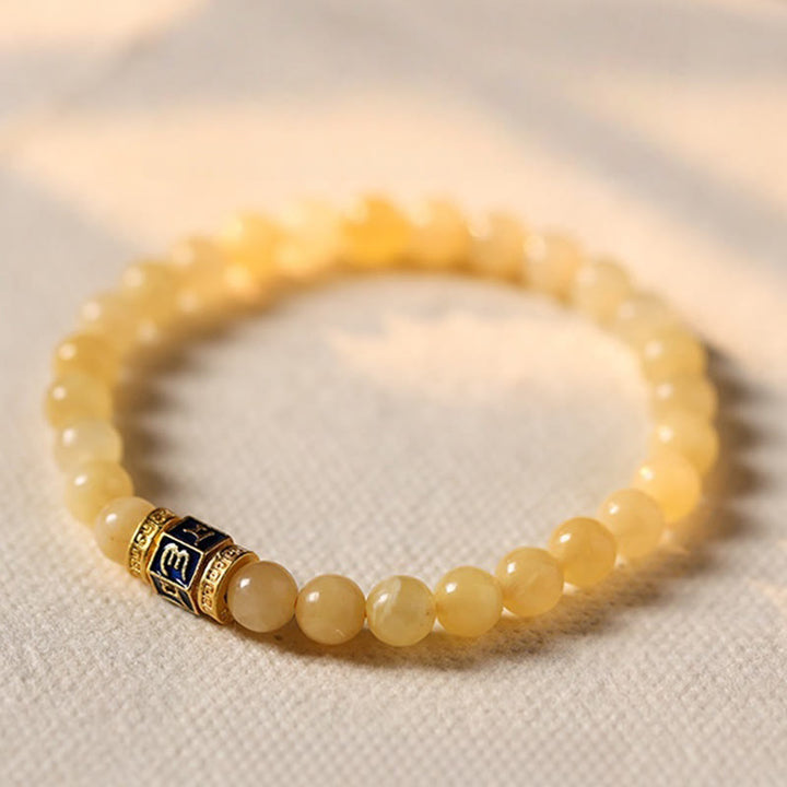 Pulsera de la fortuna de Om Mani Padme Hum con cuentas de topacio y Buddha Stones