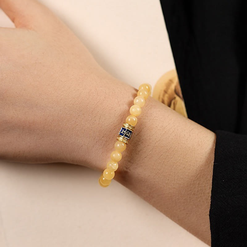 Pulsera de la fortuna de Om Mani Padme Hum con cuentas de topacio y Buddha Stones