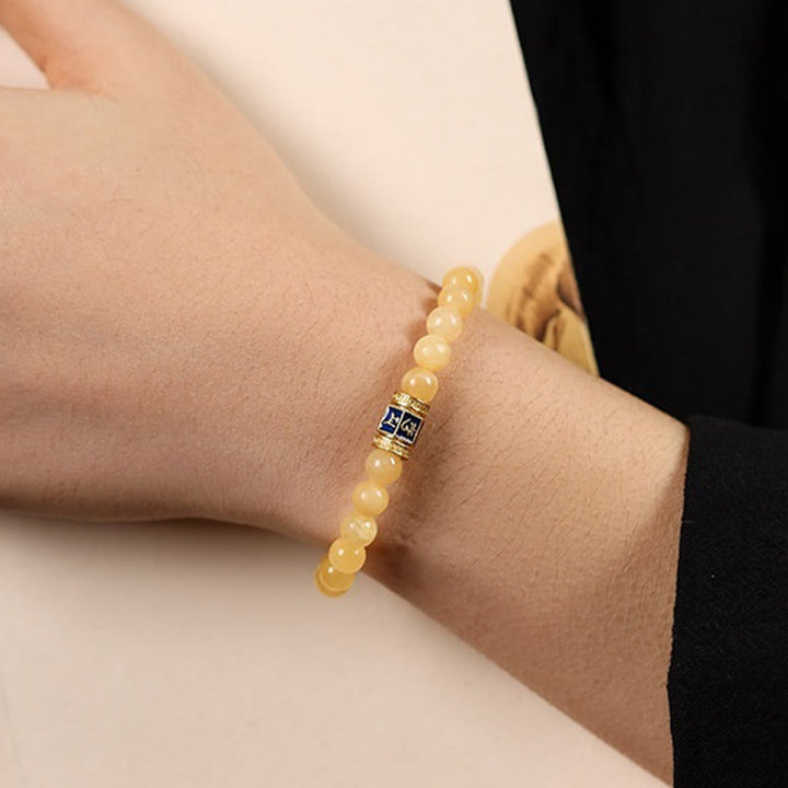 Pulsera de la fortuna de Om Mani Padme Hum con cuentas de topacio y Buddha Stones