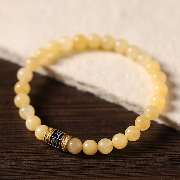 Pulsera de la fortuna de Om Mani Padme Hum con cuentas de topacio y Buddha Stones