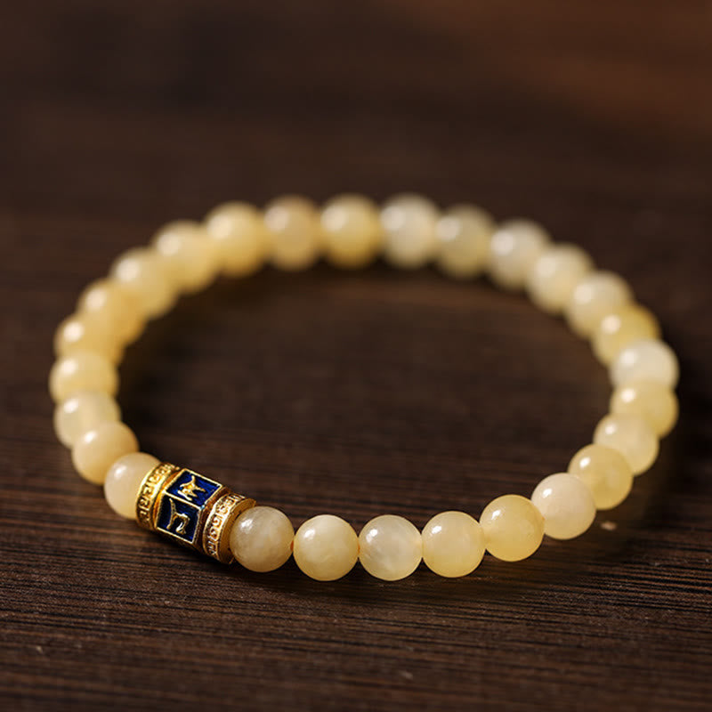 Pulsera de la fortuna de Om Mani Padme Hum con cuentas de topacio y Buddha Stones