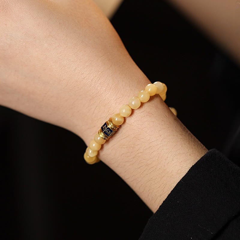 Pulsera de la fortuna de Om Mani Padme Hum con cuentas de topacio y Buddha Stones