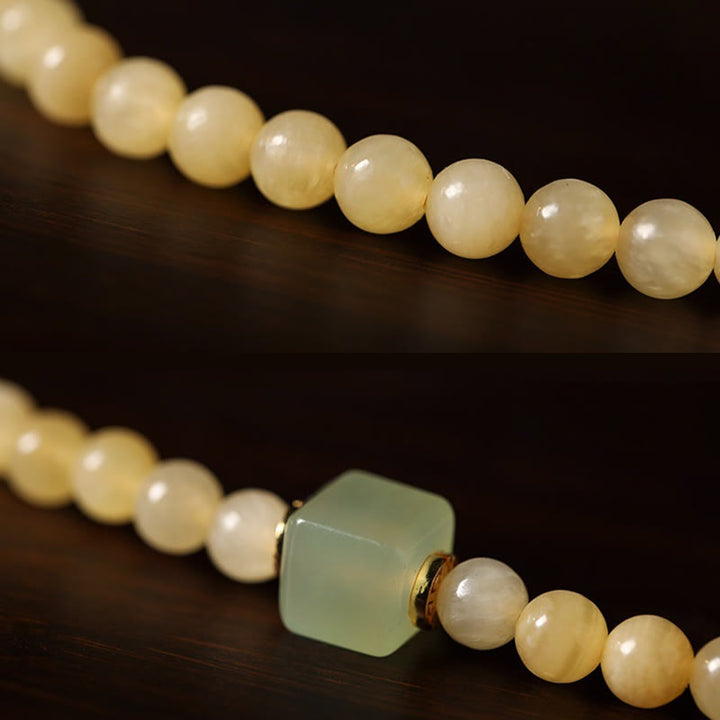 Pulsera de riqueza con doble círculo de cubo de jade y cuentas de topacio de Buddha Stones
