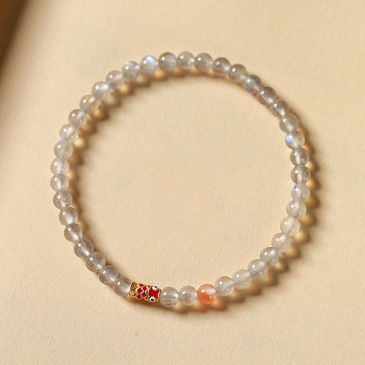 Buddha Stones Pulsera curativa ultrafina de piedra lunar con pez koi