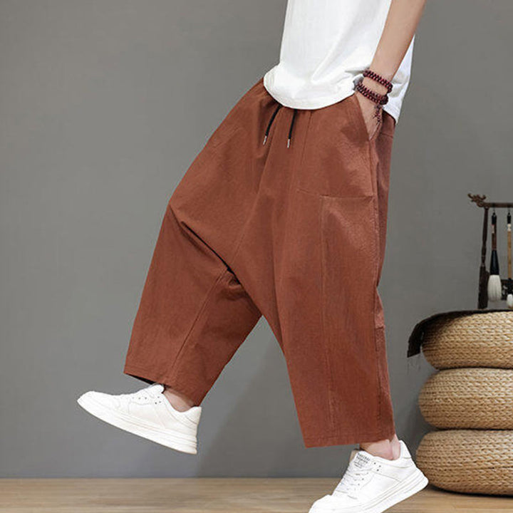 Pantalones casuales Buddha Stones de algodón con cintura elástica, pierna ancha y bolsillos, con cordón ajustable y diseño de entrepierna baja para hombre.