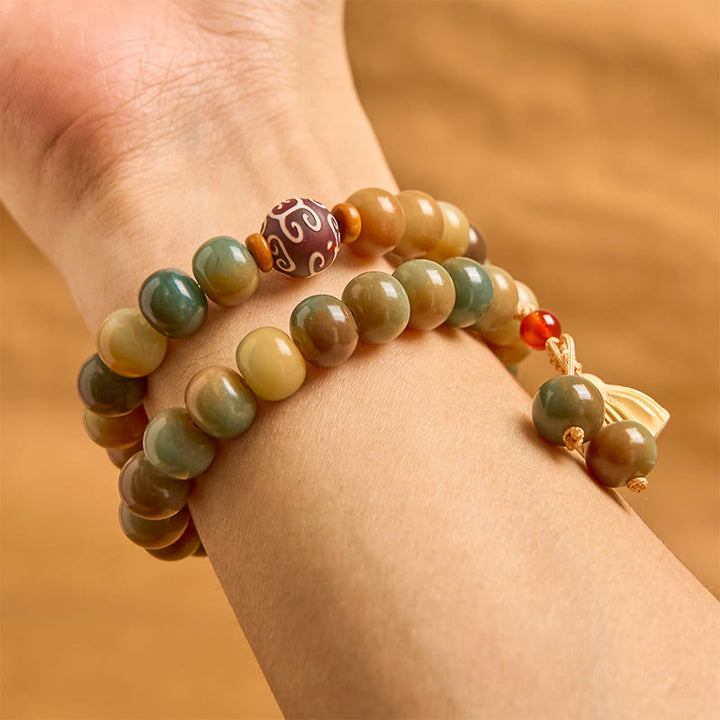 Pulsera de doble vuelta con dije de vaina de loto y semillas de bodhi coloridas de Buddha Stones