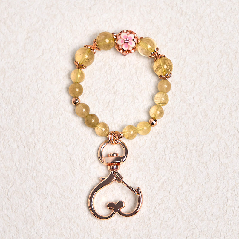 Llavero colgante de riqueza con Buddha Stones de cuarzo rutilado dorado