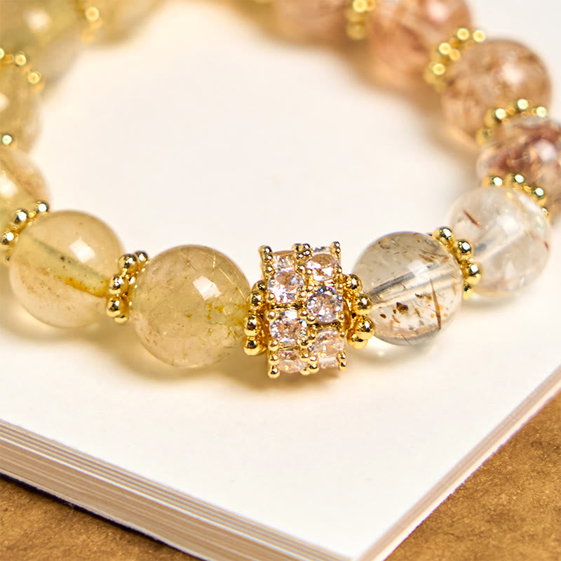 Llavero colgante de cuarzo rutilado dorado con Buddha Stones que simboliza la buena fortuna.