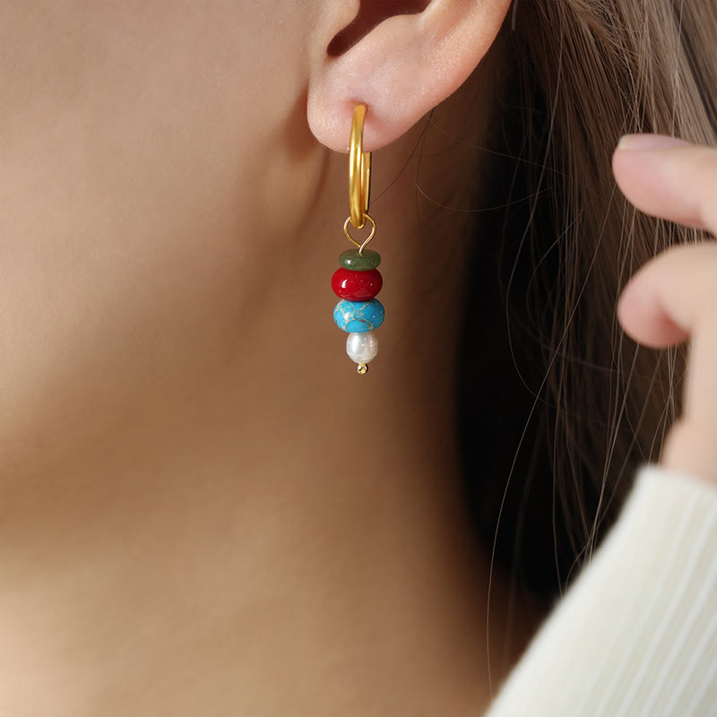 Pendientes de acero y titanio con diseño de piedra marnyi tibetana de Buddha Stones y ágata roja natural.