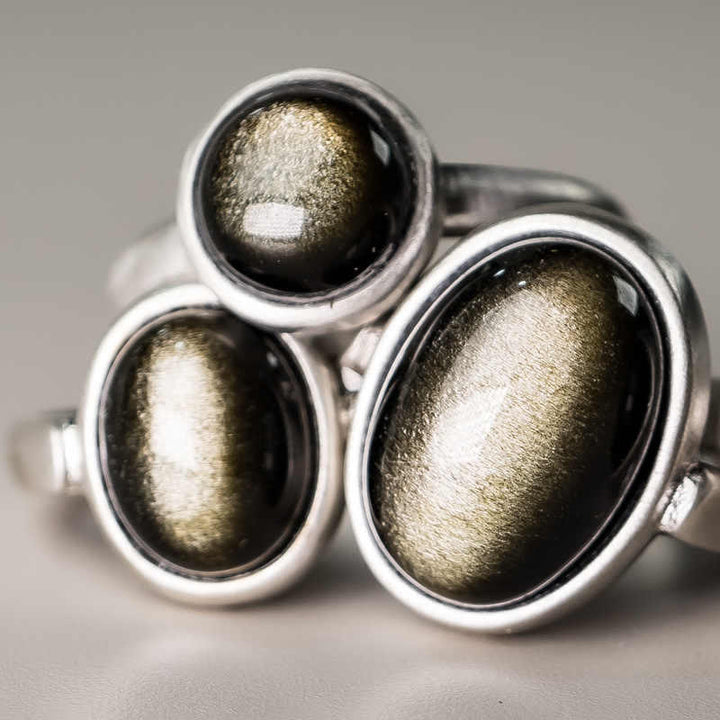 Anillo de riqueza ajustable de obsidiana con brillo dorado y plata de ley 925 natural de Buddha Stones