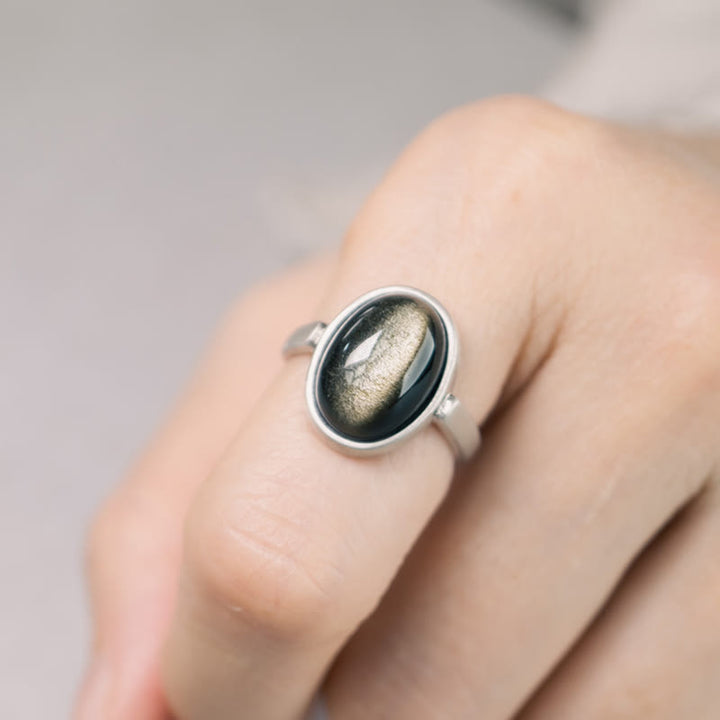 Anillo de riqueza ajustable de obsidiana con brillo dorado y plata de ley 925 natural de Buddha Stones