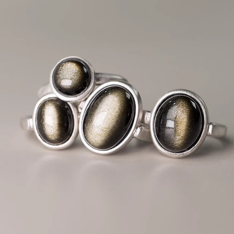 Anillo de riqueza ajustable de obsidiana con brillo dorado y plata de ley 925 natural de Buddha Stones