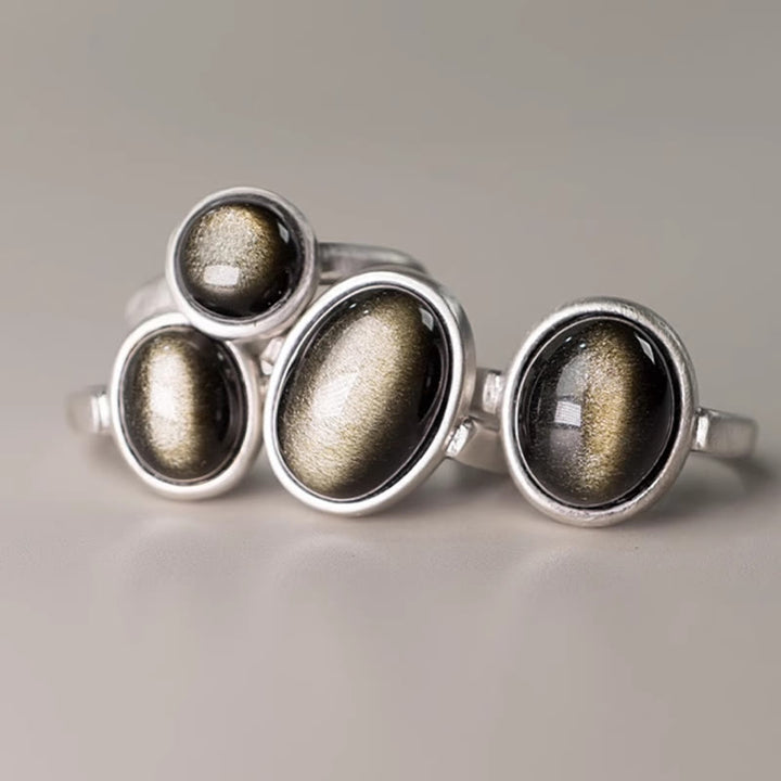Anillo de riqueza ajustable de obsidiana con brillo dorado y plata de ley 925 natural de Buddha Stones