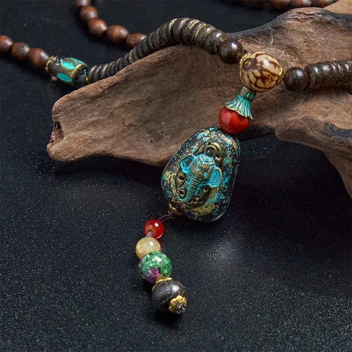 Collar con colgante de cabeza de elefante con cuentas Dzi de madera de wengué tibetana hechas a mano con Buddha Stones