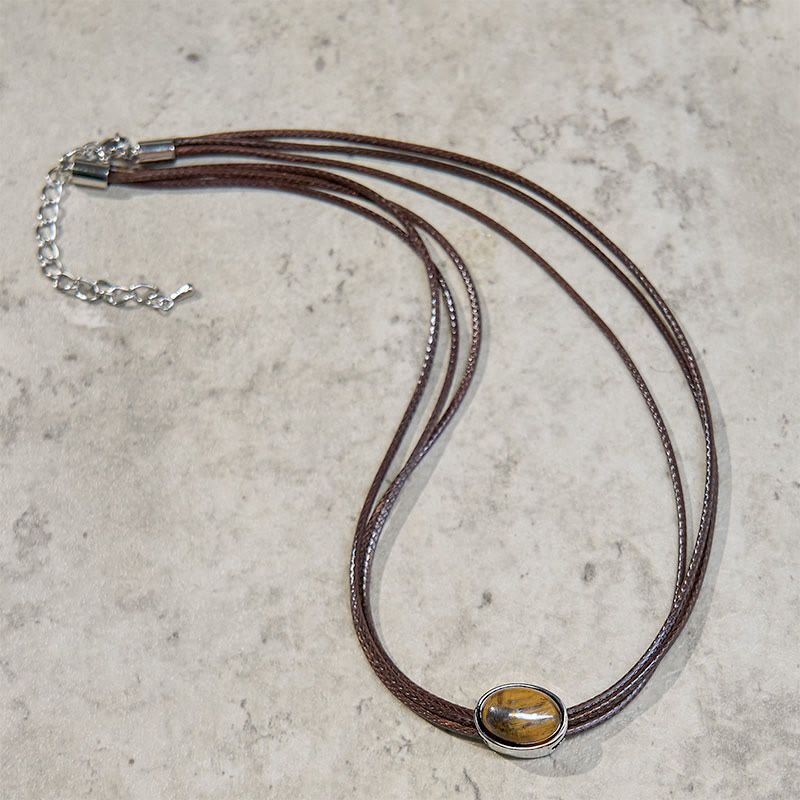 Collar con colgante de cuerda de cera con protección elíptica de ojo de tigre natural y Buddha Stones