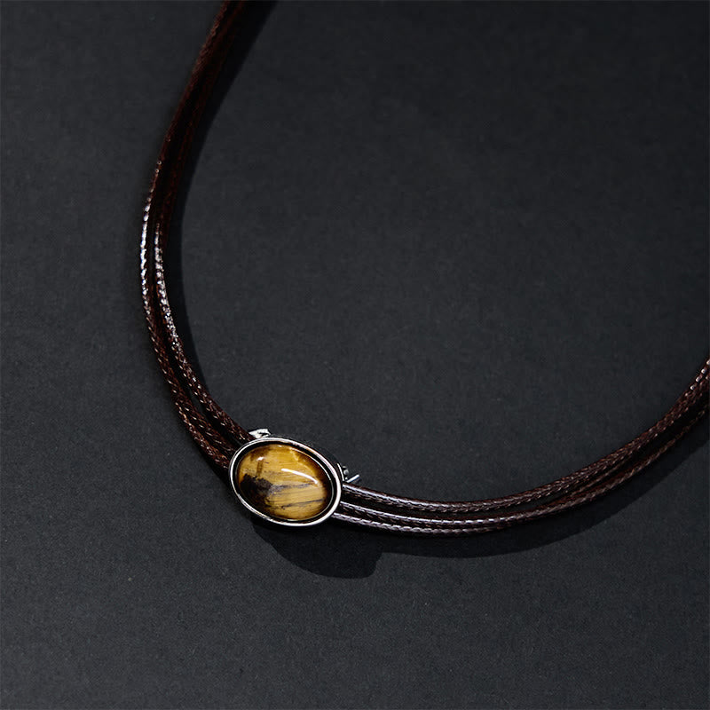 Collar con colgante de cuerda de cera con protección elíptica de ojo de tigre natural y Buddha Stones