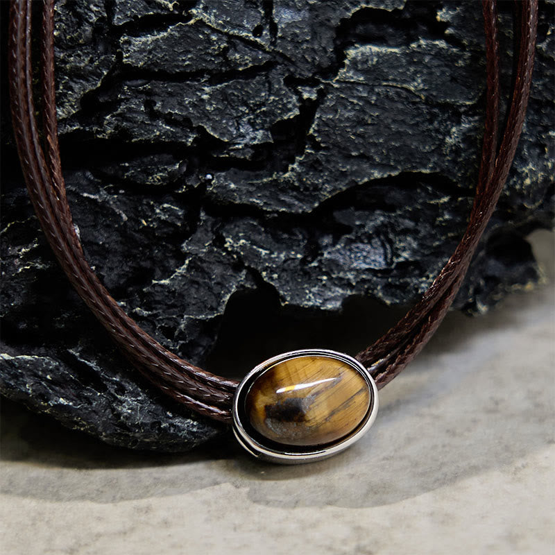 Collar con colgante de cuerda de cera con protección elíptica de ojo de tigre natural y Buddha Stones