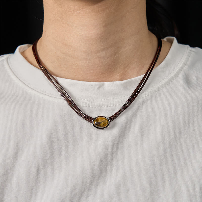 Collar con colgante de cuerda de cera con protección elíptica de ojo de tigre natural y Buddha Stones