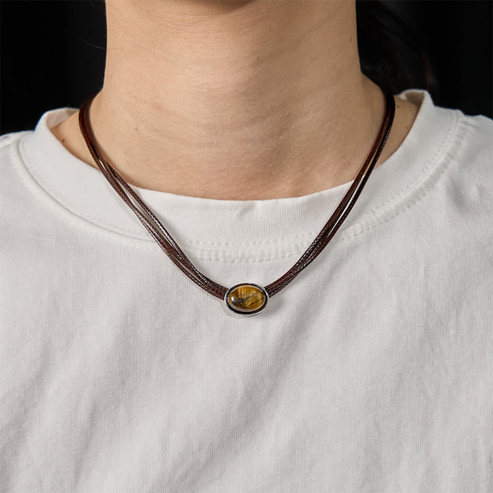 Collar con colgante de cuerda de cera con protección elíptica de ojo de tigre natural y Buddha Stones