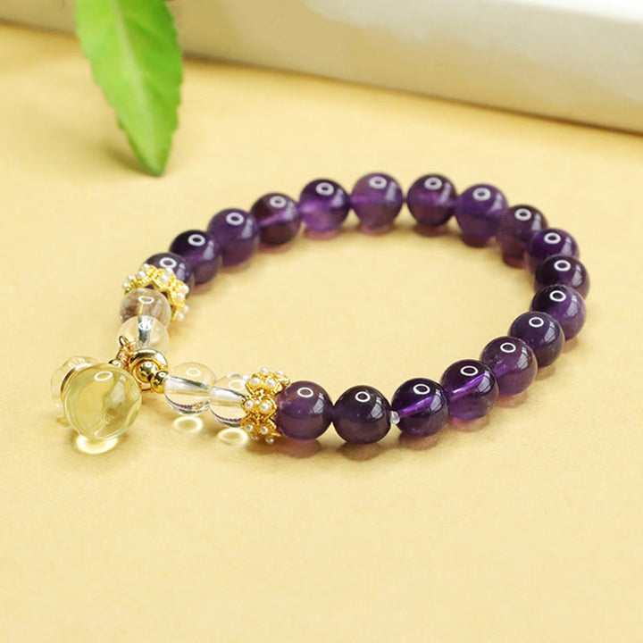 Pulsera de equilibrio con forma de bolsa de dinero de amatista y citrino natural de Buddha Stones